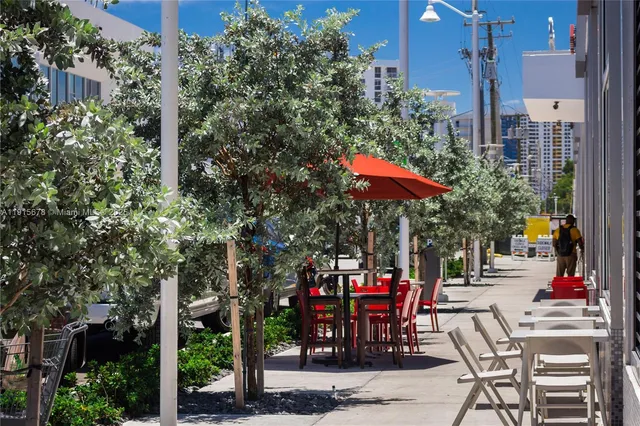 a outdoor space with lots of tables and chairs