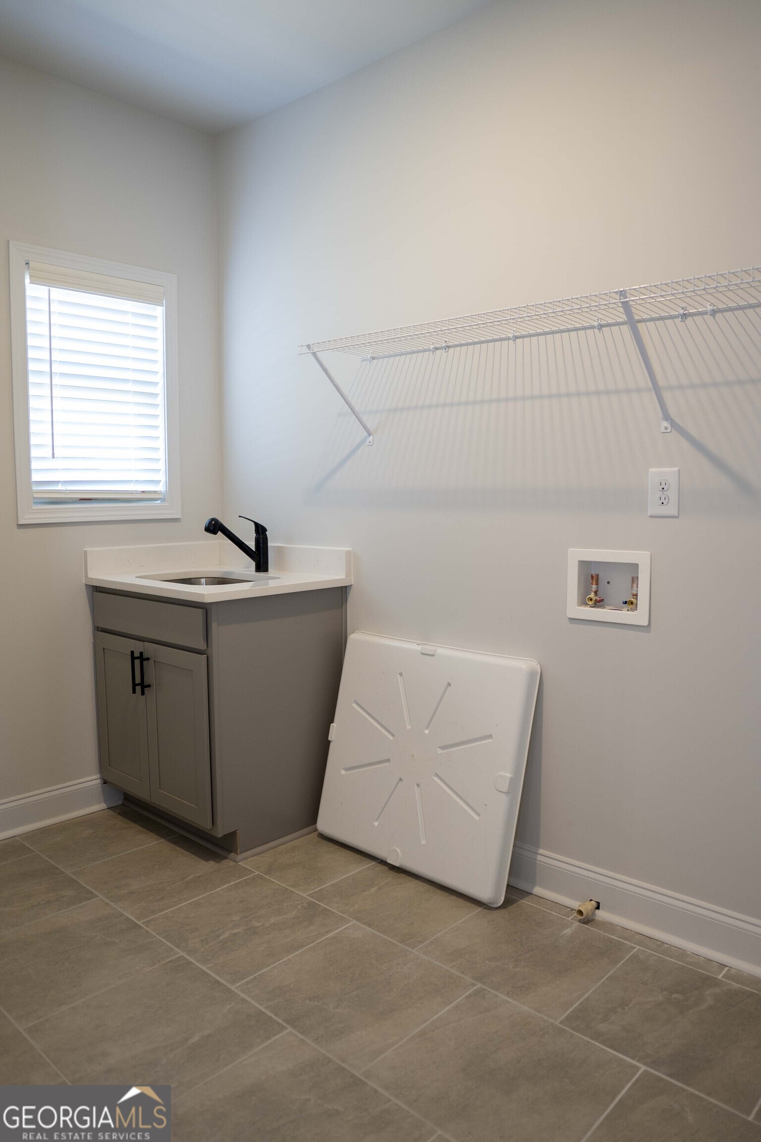 600 Beaver Court Perry, GA 31069 - Photo 44 of 48 a room with a wooden floor and white walls
