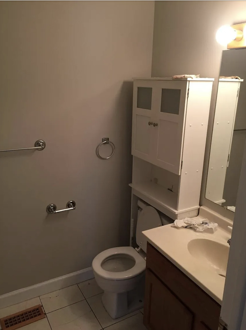 206 Sunset Court Vernon Hills, IL 60061 - Photo 12 of 13 a bathroom with a sink toilet and mirror