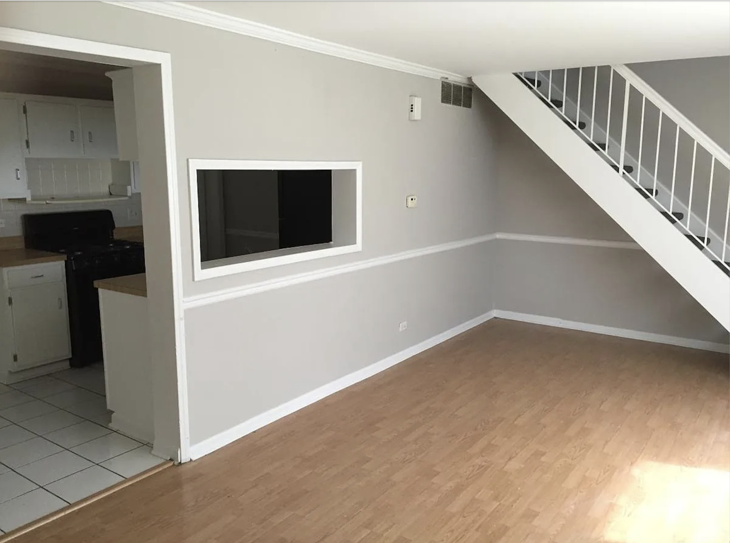 206 Sunset Court Vernon Hills, IL 60061 - Photo 3 of 13 a view of an empty room with a fireplace and a window