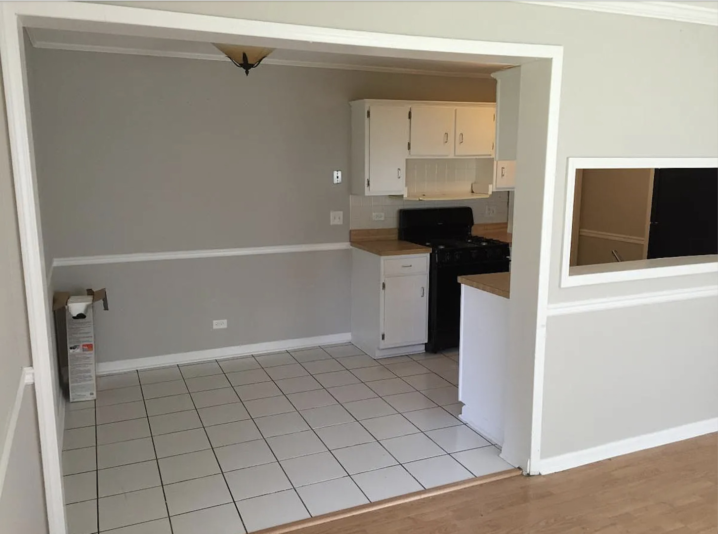 206 Sunset Court Vernon Hills, IL 60061 - Photo 8 of 13 a kitchen with white cabinets and a sink
