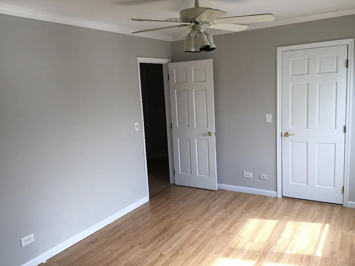 206 Sunset Court Vernon Hills, IL 60061 - Photo 9 of 13 a view of empty room with wooden floor and fan