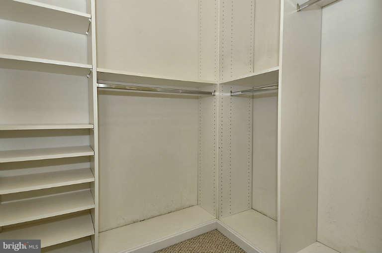 24 Courthouse Square, Unit 907 Rockville, MD 20850 - Photo 14 of 30 a view of walk in closet with empty racks