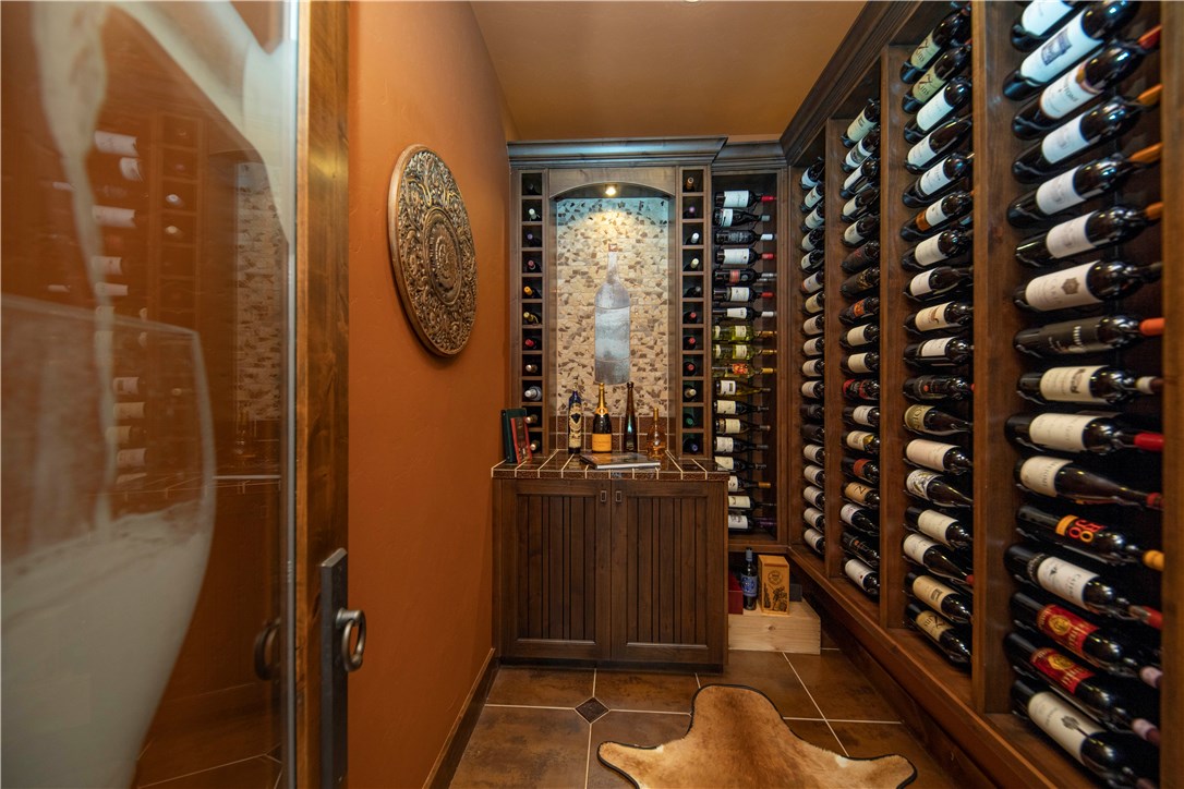130 Hunter's Knob Road Silverthorne, CO 80498 - Photo 27 of 35 This well appointed approximately 200-300 bottle cellar features a laser etched wine glass door and a beautiful custom tile mosaic inset adorning the tasting table.