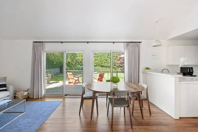 a dining room with furniture window wooden floor