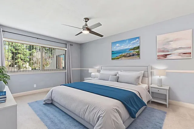 an empty room with closet and windows