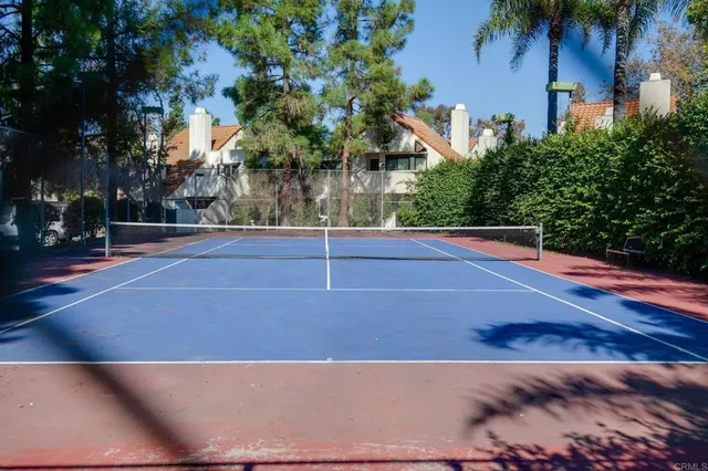 a view of a house with pool and a yard
