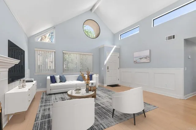 a kitchen with stainless steel appliances a refrigerator stove microwave and white cabinets