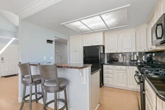 a view of a house with a palm tree