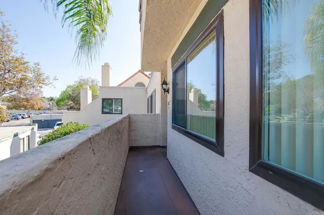 a view of a room with window and hardwood floor