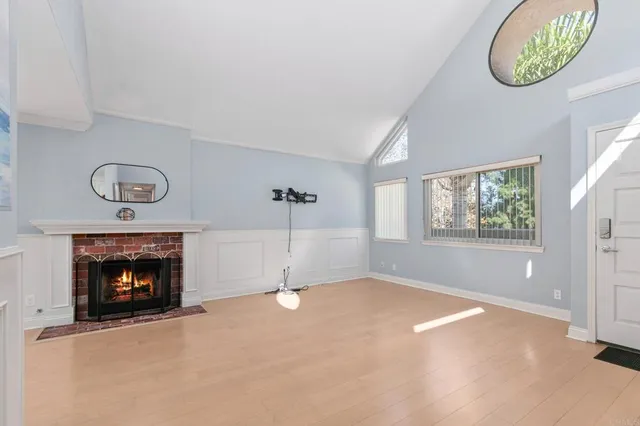 a view of dining room with furniture and a chandelier