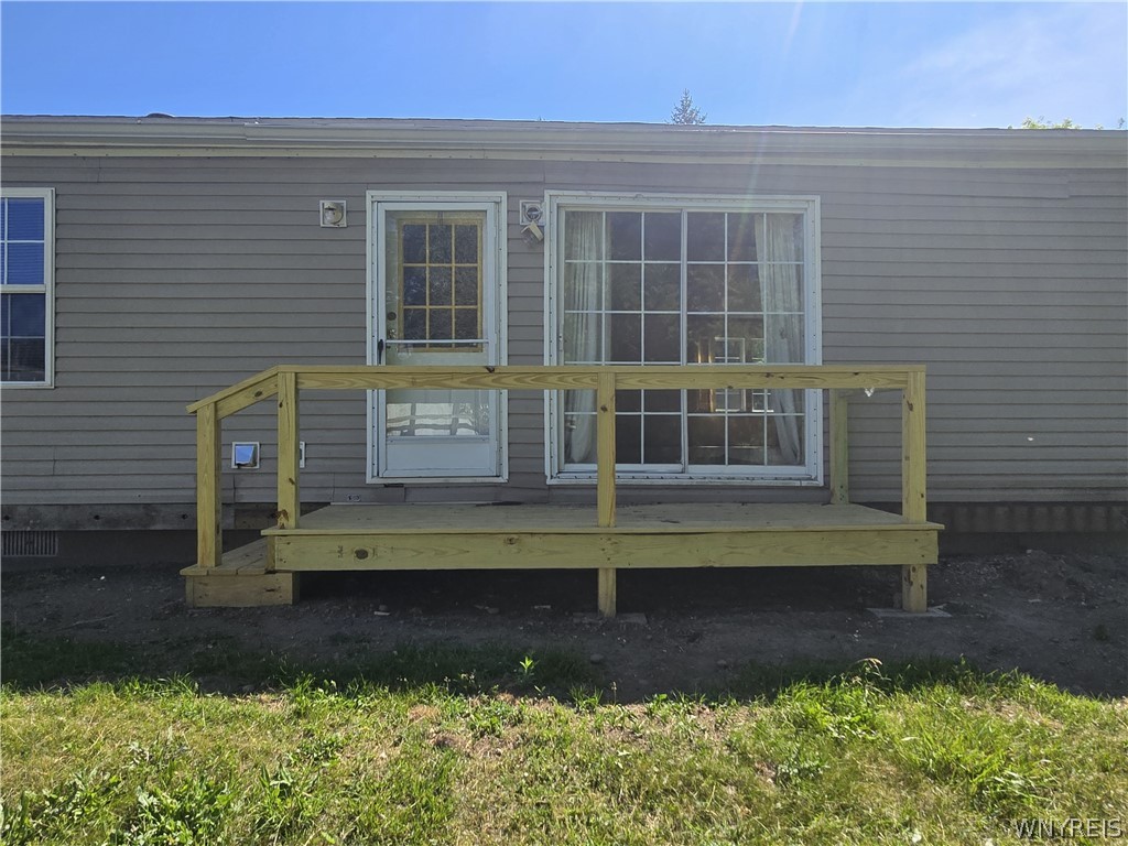 12507 Ridge Road Ridgeway, NY 14103 - Photo 13 of 22 back deck (12 x 5) off of kitchen/laundry room