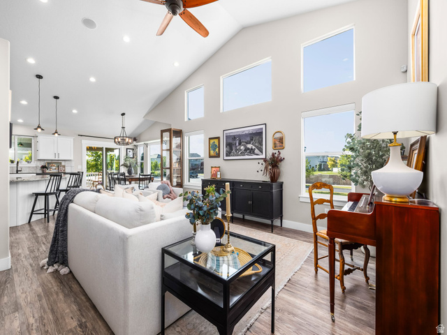 7 Sterling Loop Vineyard, UT 84059 - Photo 10 of 43 Vaulted great room featuring wood-finish flooring, recessed lighting, and a ceiling fan