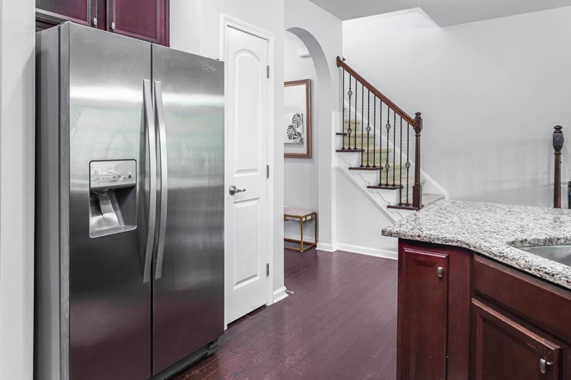 68 Argonaut Drive Durham, NC 27705 - Photo 11 of 29 a kitchen with stainless steel appliances granite countertop a refrigerator and a sink