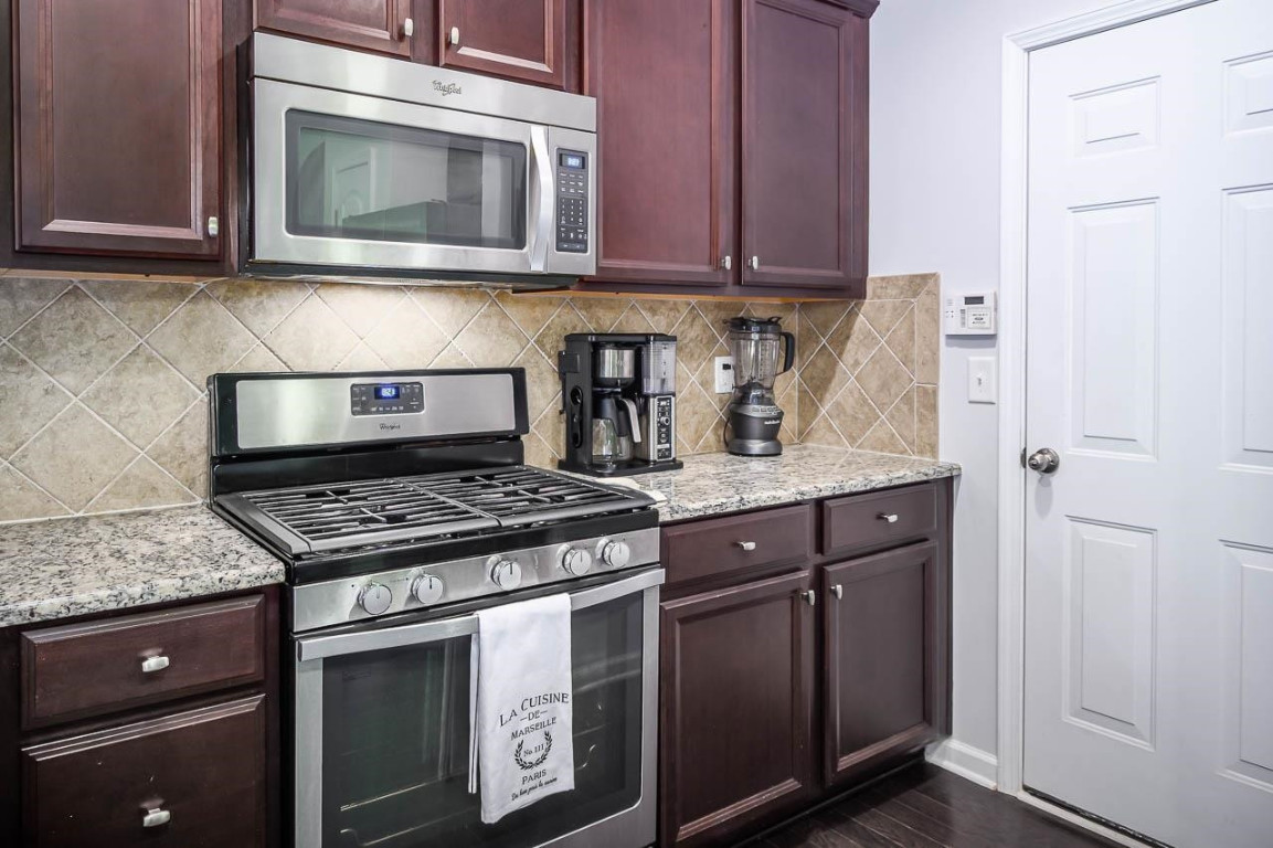 68 Argonaut Drive Durham, NC 27705 - Photo 12 of 29 a stove top oven sitting inside of a kitchen