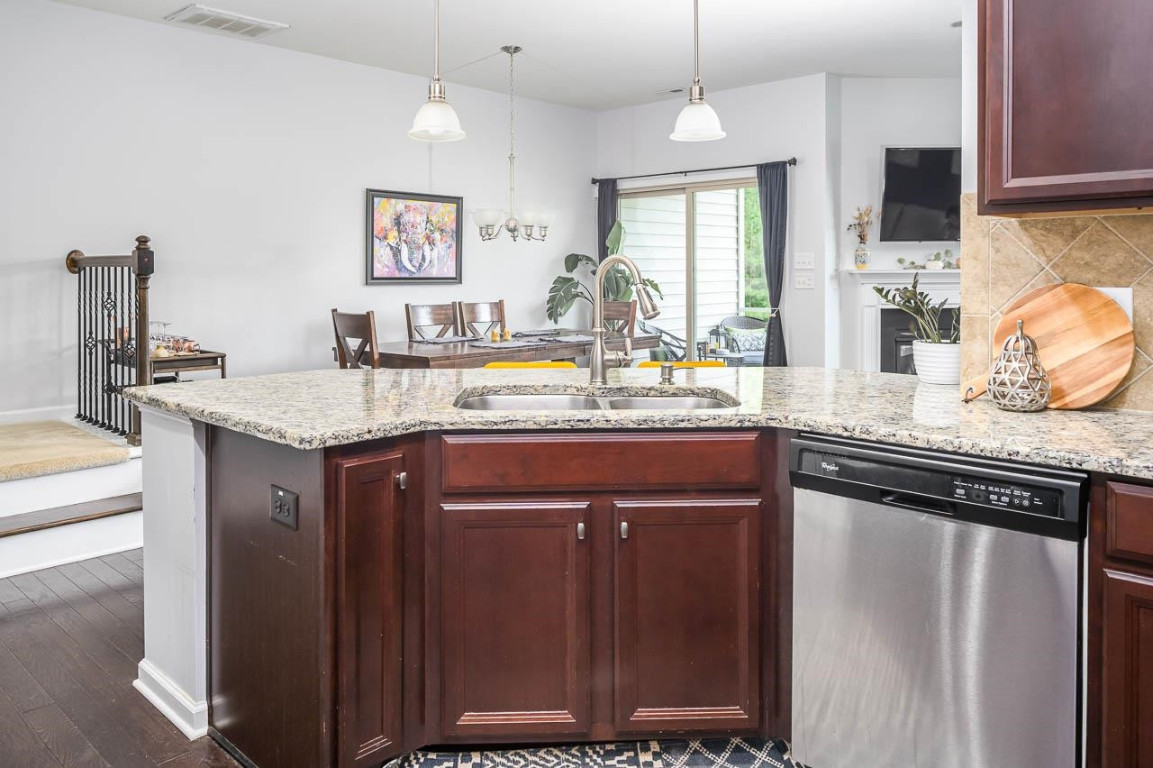 68 Argonaut Drive Durham, NC 27705 - Photo 13 of 29 a kitchen with granite countertop a sink cabinets and window