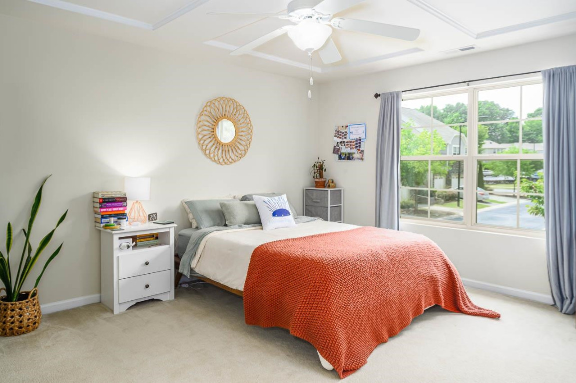 68 Argonaut Drive Durham, NC 27705 - Photo 17 of 29 a bedroom with a bed and a large window
