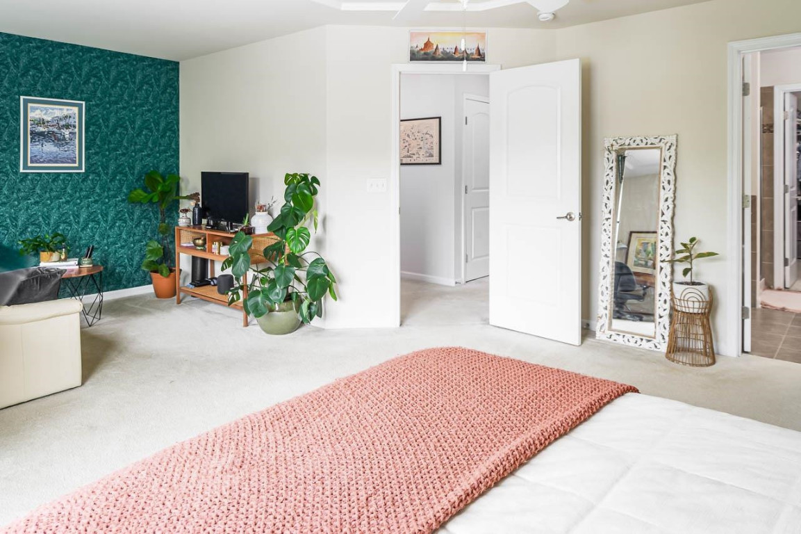 68 Argonaut Drive Durham, NC 27705 - Photo 18 of 29 a bedroom with a bed and a couch