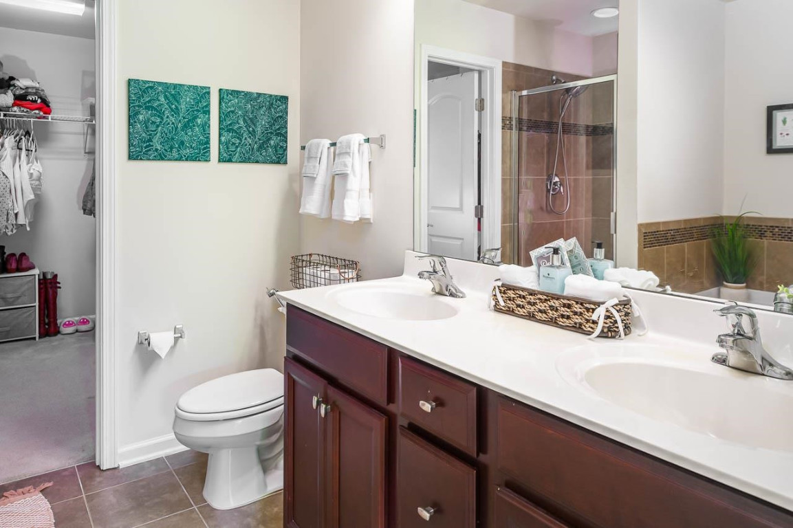 68 Argonaut Drive Durham, NC 27705 - Photo 20 of 29 a bathroom with a sink toilet and shower