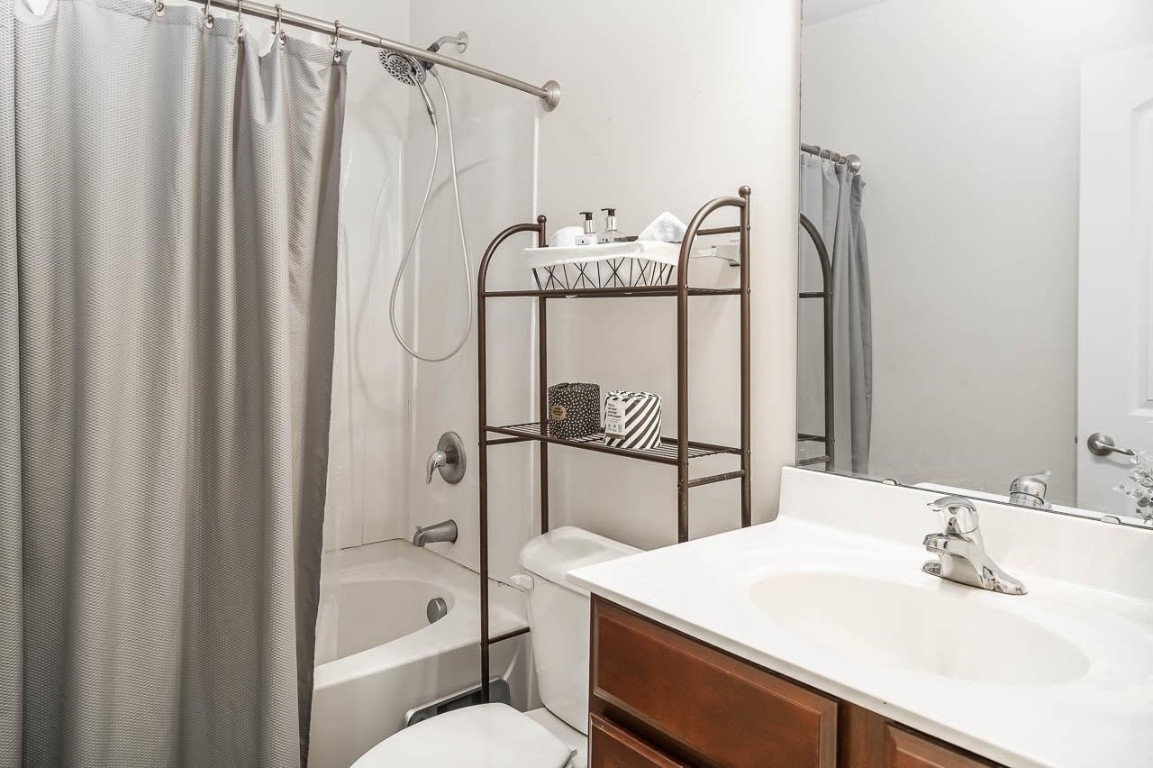 68 Argonaut Drive Durham, NC 27705 - Photo 23 of 29 a bathroom with a granite countertop sink toilet and shower