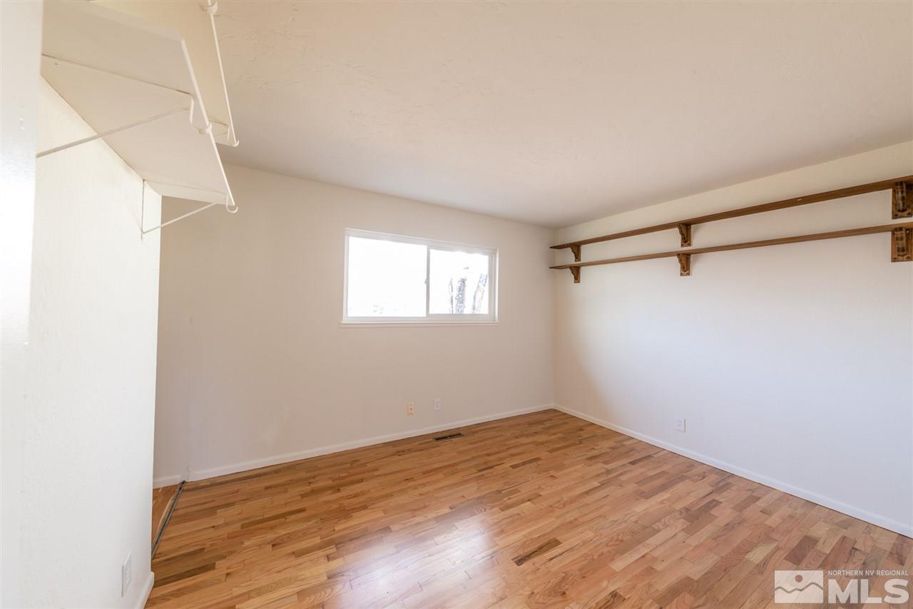 725 James Court Reno, NV 89503 - Photo 8 of 29 a view of a big room with wooden floor and windows
