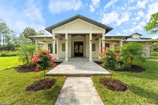 a front view of a house with garden
