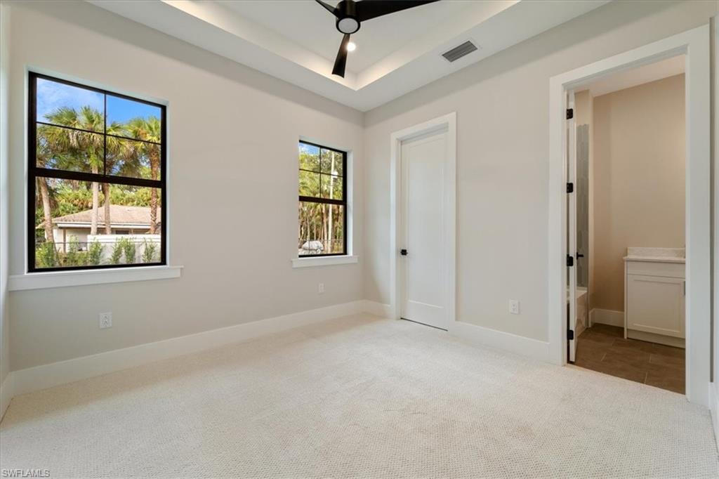 699 1st Street Northwest Naples, FL 34120 - Photo 24 of 42 a view of an empty room with a window