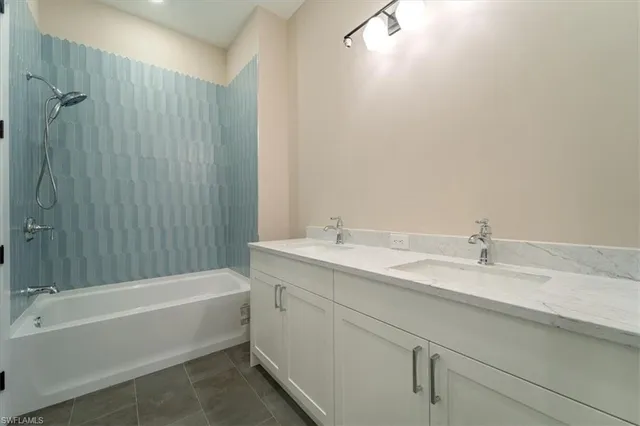 a bathroom with a tub a sink and mirror