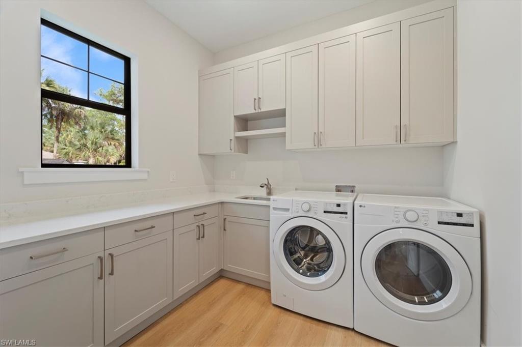 699 1st Street Northwest Naples, FL 34120 - Photo 36 of 42 a utility room with dryer and washer