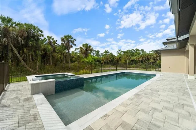 a view of swimming pool with a yard