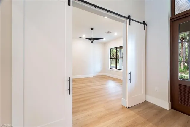 an empty room that has a window in it