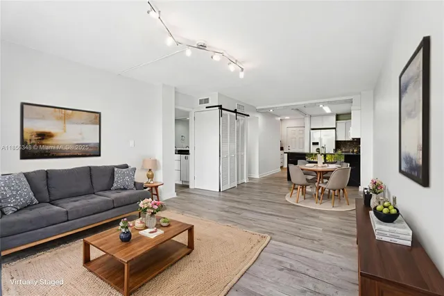a view of a kitchen with a sink and a refrigerator