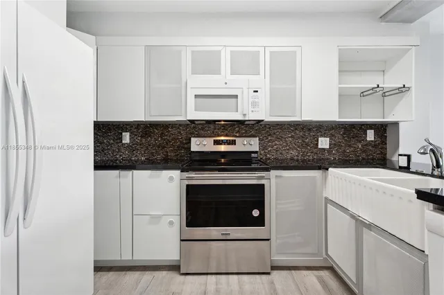 a view of a hallway with washer and dryer