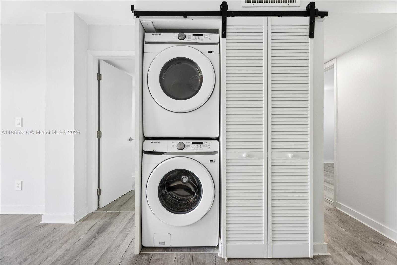750 Northeast 64th Street, Unit B500 Miami, FL 33138 - Photo 16 of 29 a view of a hallway with washer and dryer