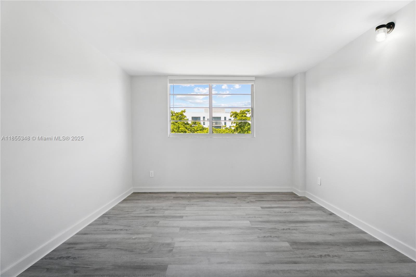 750 Northeast 64th Street, Unit B500 Miami, FL 33138 - Photo 18 of 29 a view of an empty room with a window