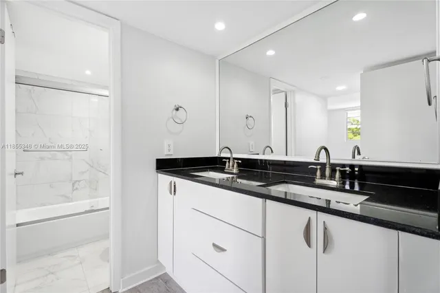 a bathroom with a toilet and a bathtub