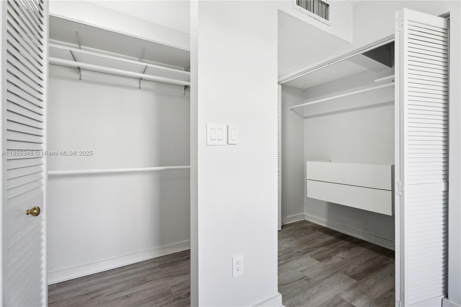 750 Northeast 64th Street, Unit B500 Miami, FL 33138 - Photo 21 of 29 a view of an empty walk in closet