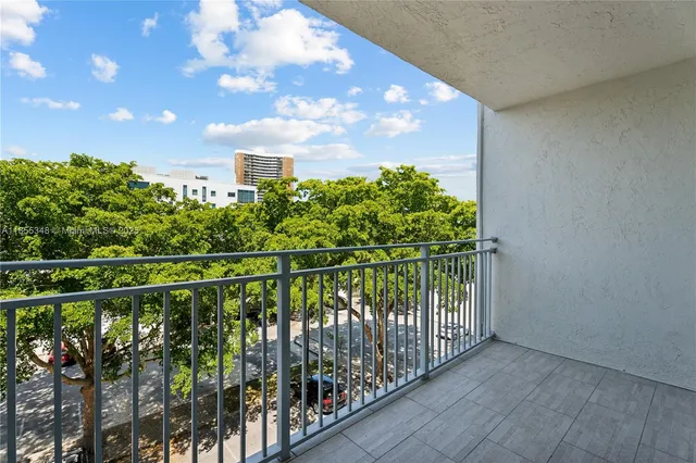 a room with lots of books and a baby crib