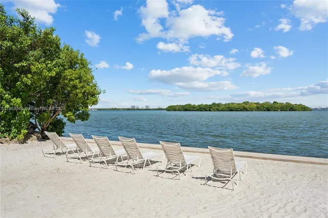 a view of car parked on the side of a street