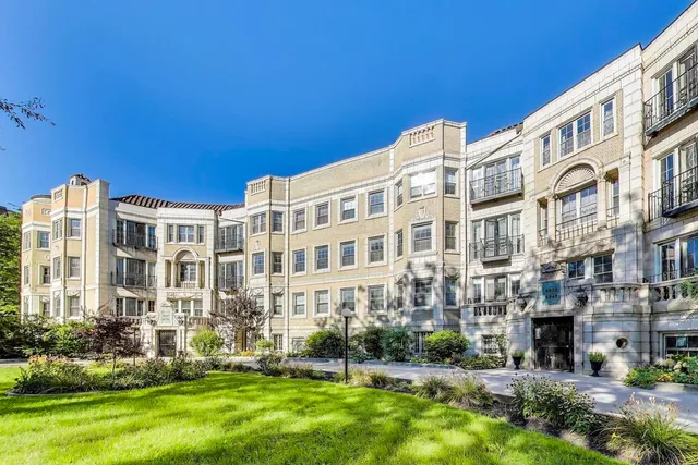 a view of a building with a yard