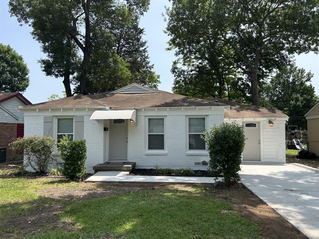 6318 Belgrade Avenue Dallas, TX 75227 - Photo 1 of 23 a front view of a house with a garden