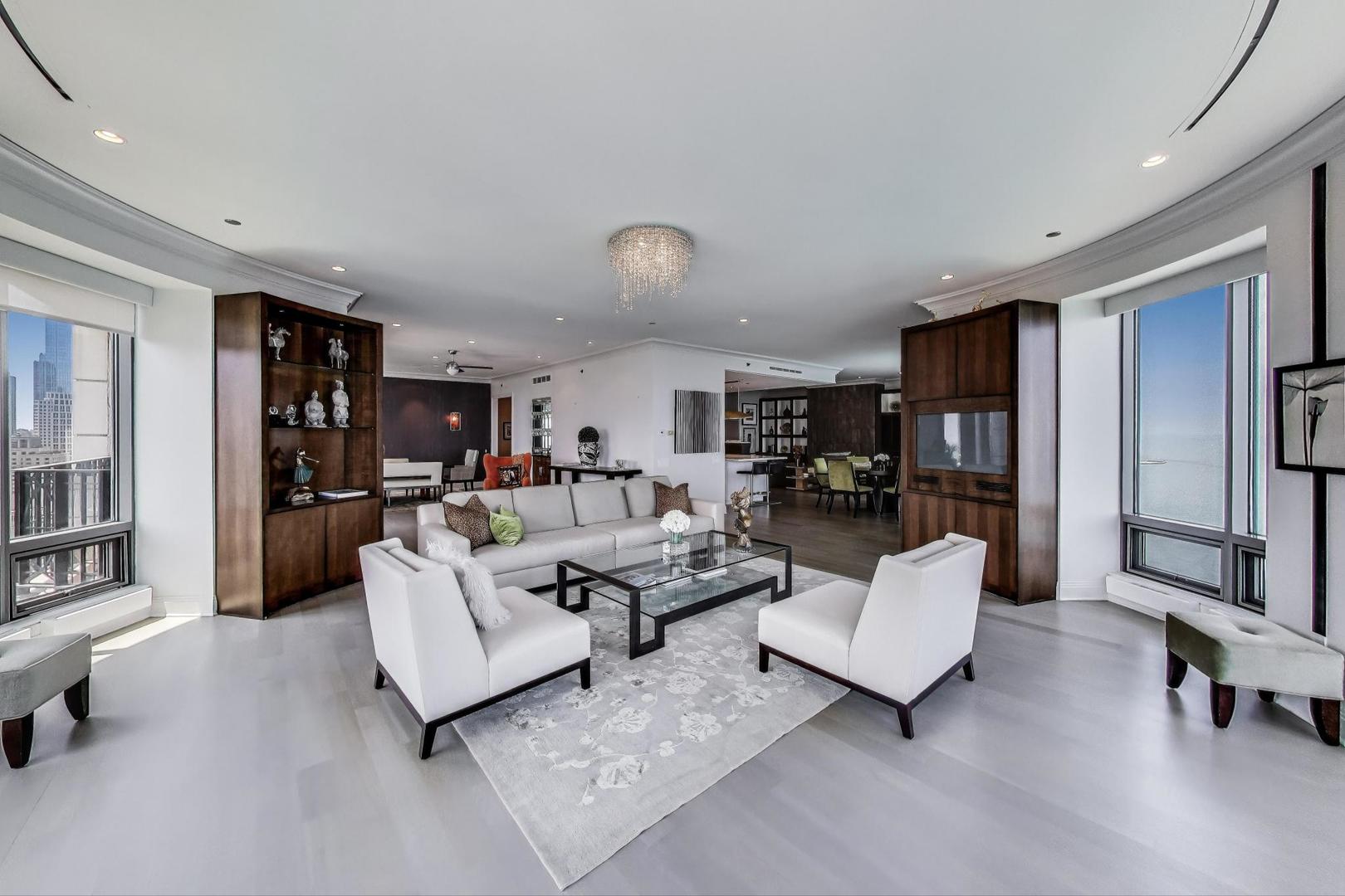 840 North Lake Shore Drive, Unit 2401 Chicago, IL 60611 - Photo 11 of 40 a living room with furniture and a wooden floor