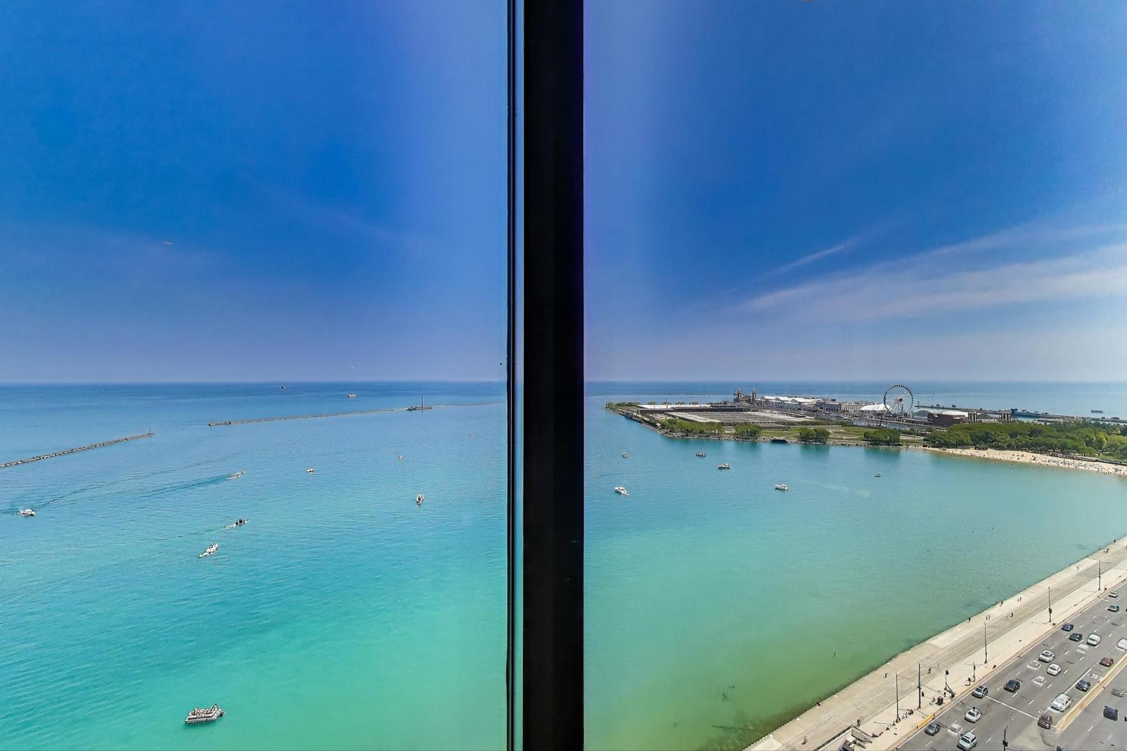840 North Lake Shore Drive, Unit 2401 Chicago, IL 60611 - Photo 12 of 40 a view of a lake from a balcony