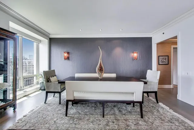 a view of a dining room with furniture window and wooden floor