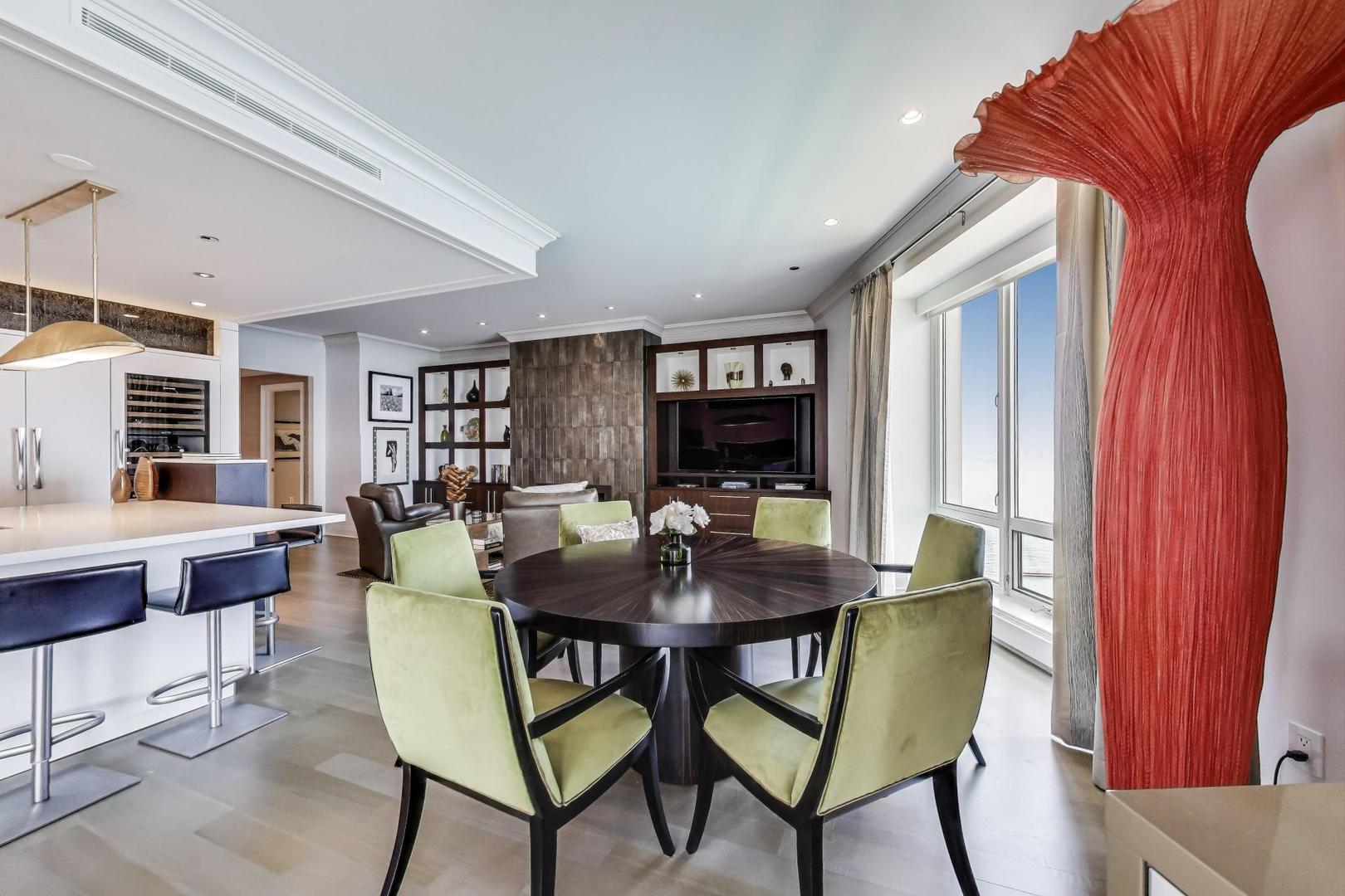 840 North Lake Shore Drive, Unit 2401 Chicago, IL 60611 - Photo 19 of 40 a view of a dining room with furniture and window