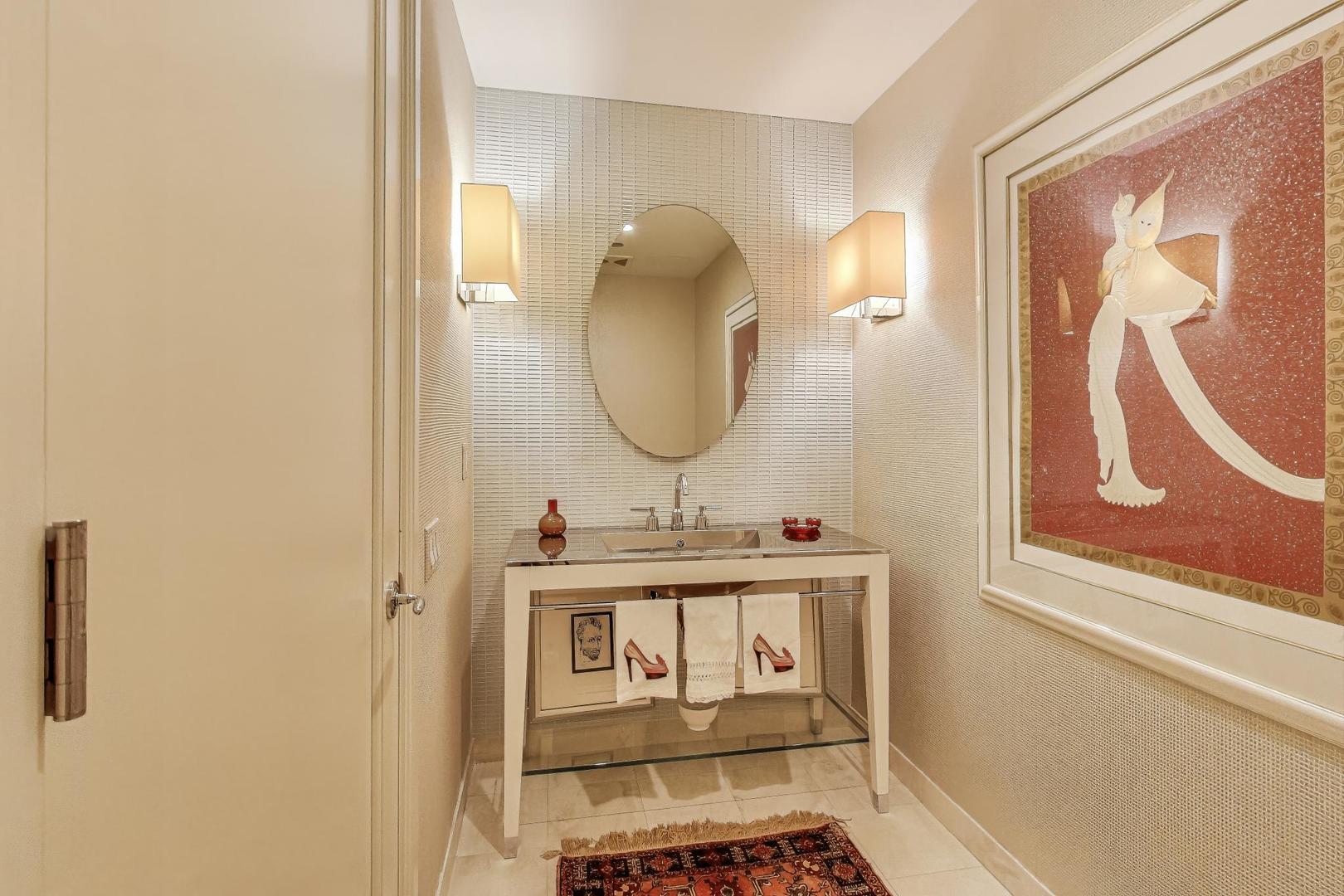 840 North Lake Shore Drive, Unit 2401 Chicago, IL 60611 - Photo 23 of 40 a bathroom with a sink and a mirror