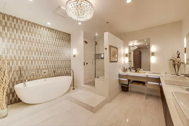 a bathroom with a tub and shower
