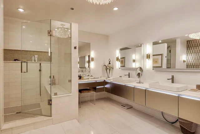 a living room with furniture kitchen view and a potted plant