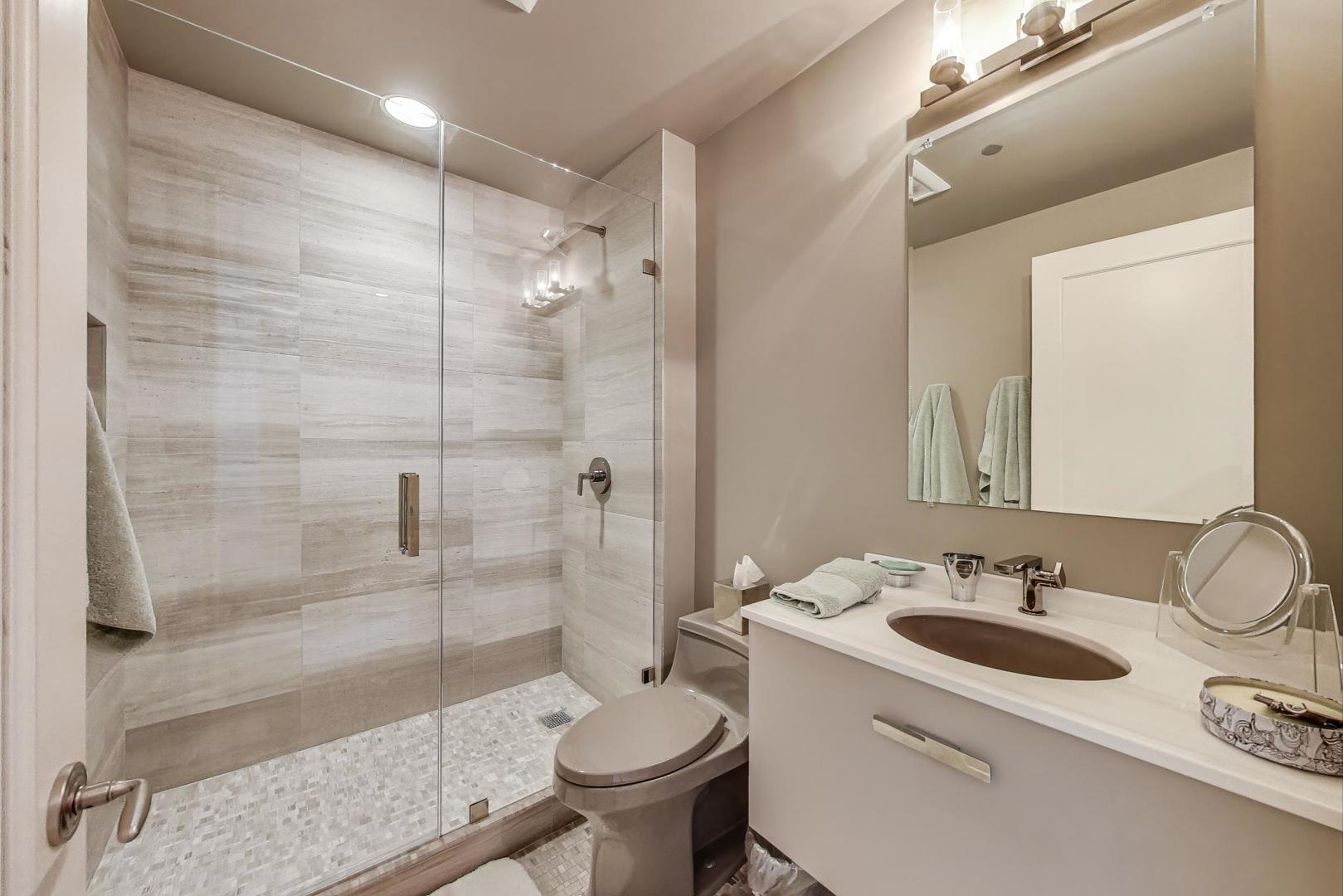 840 North Lake Shore Drive, Unit 2401 Chicago, IL 60611 - Photo 36 of 40 a bathroom with a sink toilet and shower