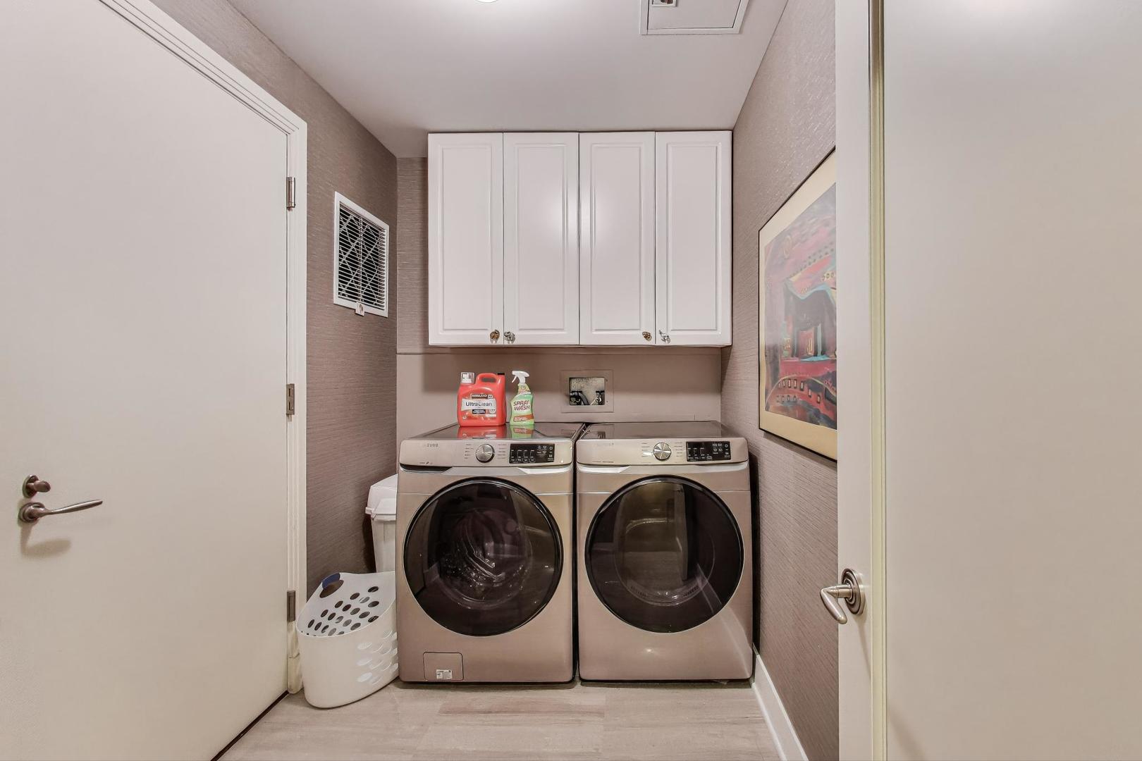 840 North Lake Shore Drive, Unit 2401 Chicago, IL 60611 - Photo 37 of 40 a view of storage and utility room with washer and dryer